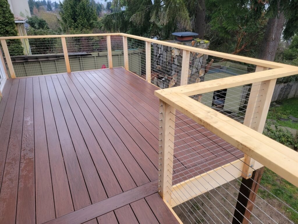 Composite deck, hidden clip fasteners, custom cable railing. Normandy Park