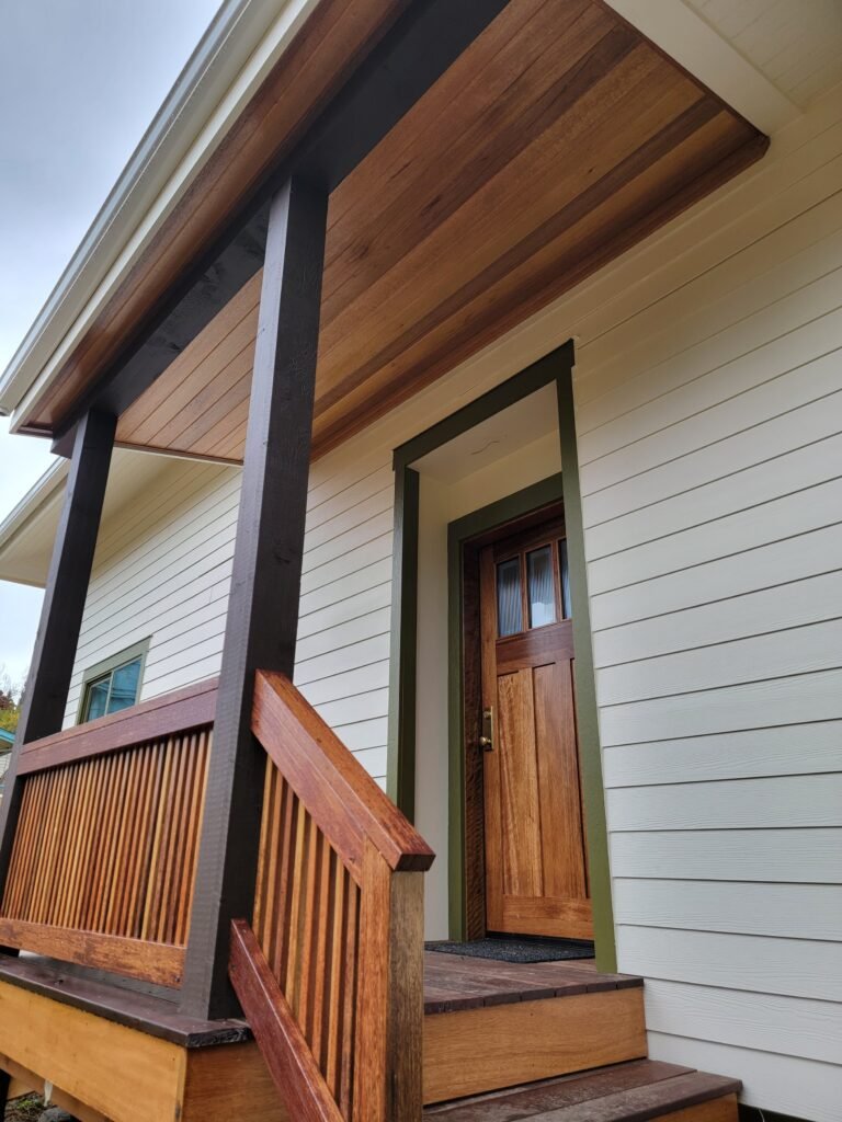 Complete porch remodel. New Mahogany door, siding and trim