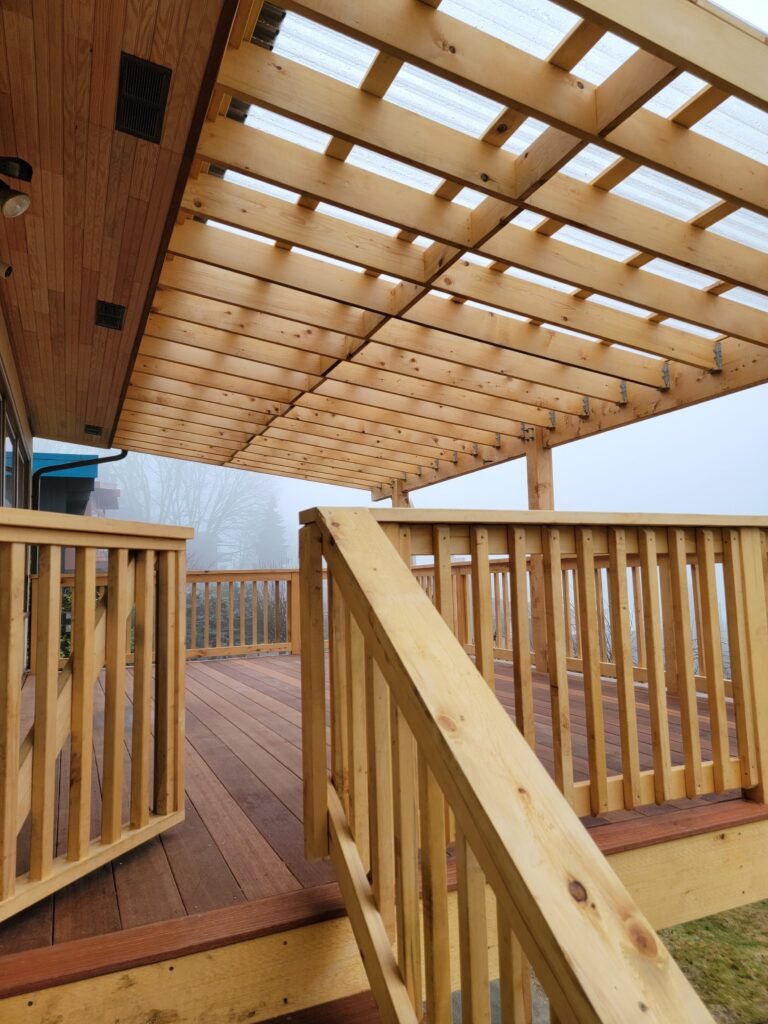 Pergola with clear rain ceiling allows this mahogany deck to be dry year round. Alaskan Yellow Cedar is incredibly weather resistant and it’s use on this project helped us avoid having to use ugly pressure treated lumber. Rainier Beach, Seattle